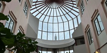 The Connecticut capitol building is pictured through a window
