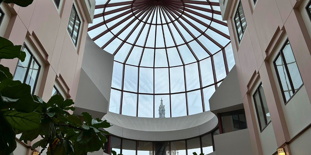 The Connecticut capitol building is pictured through a window