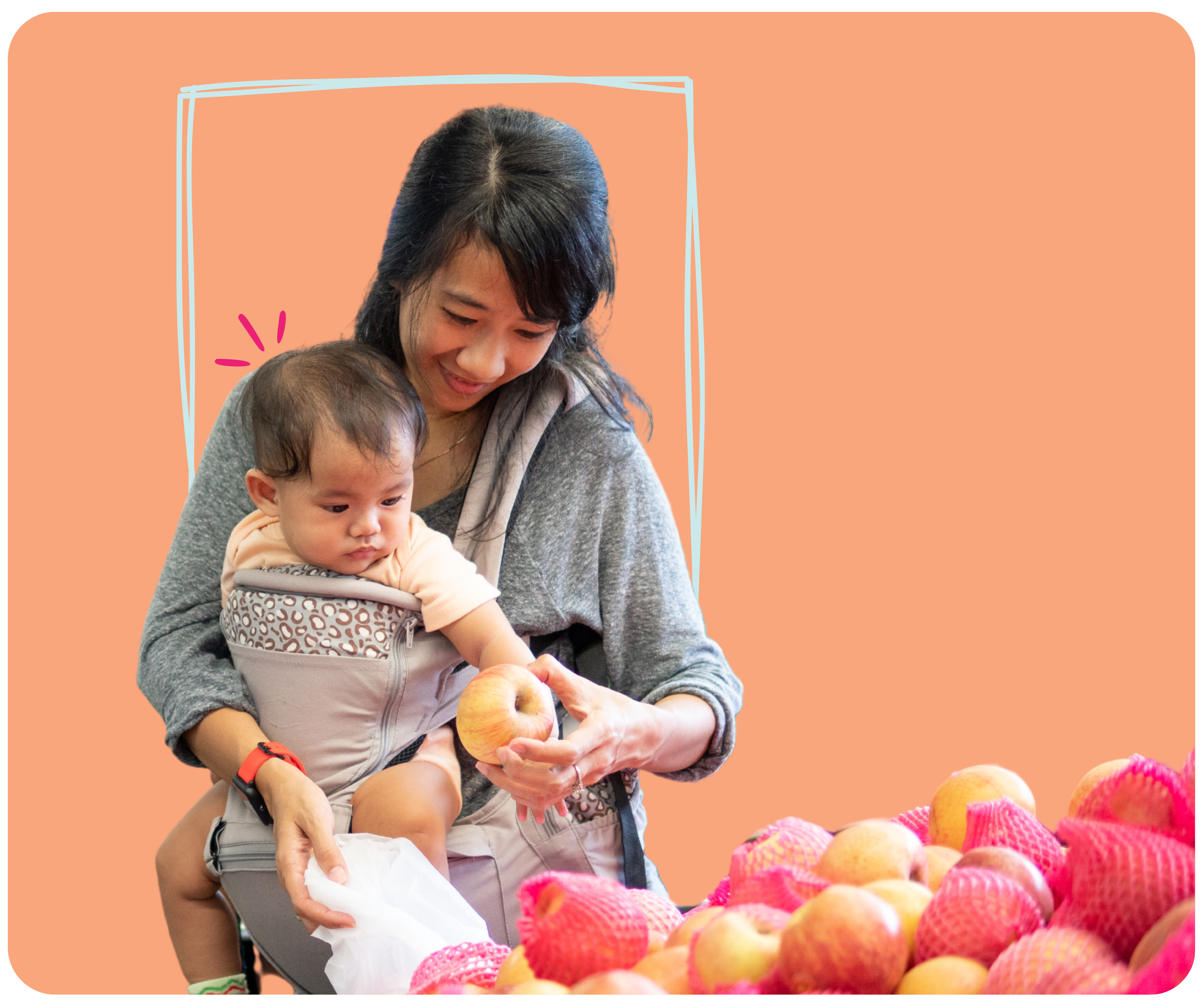 Woman with baby picking apples