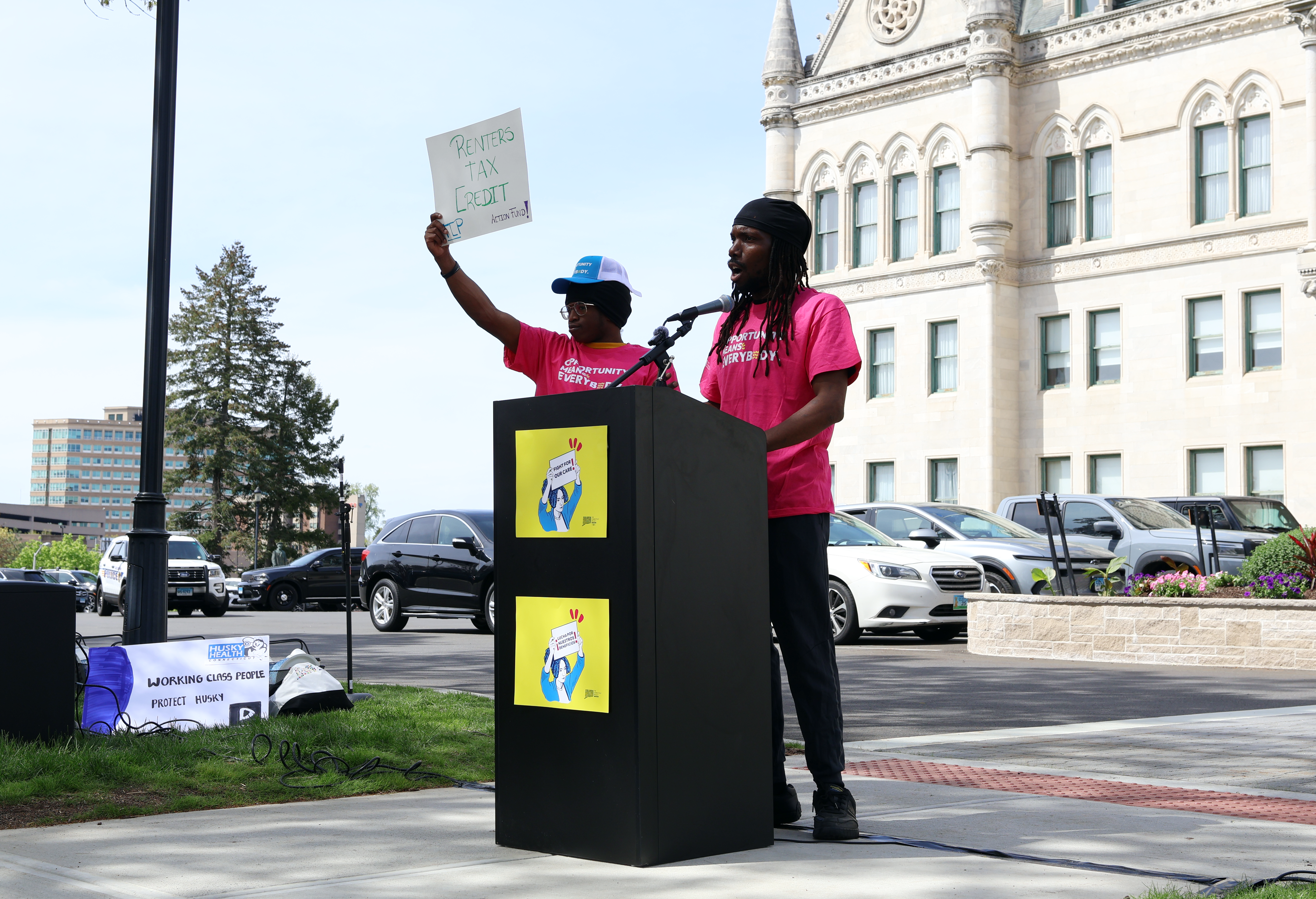 Two men stand at a podium